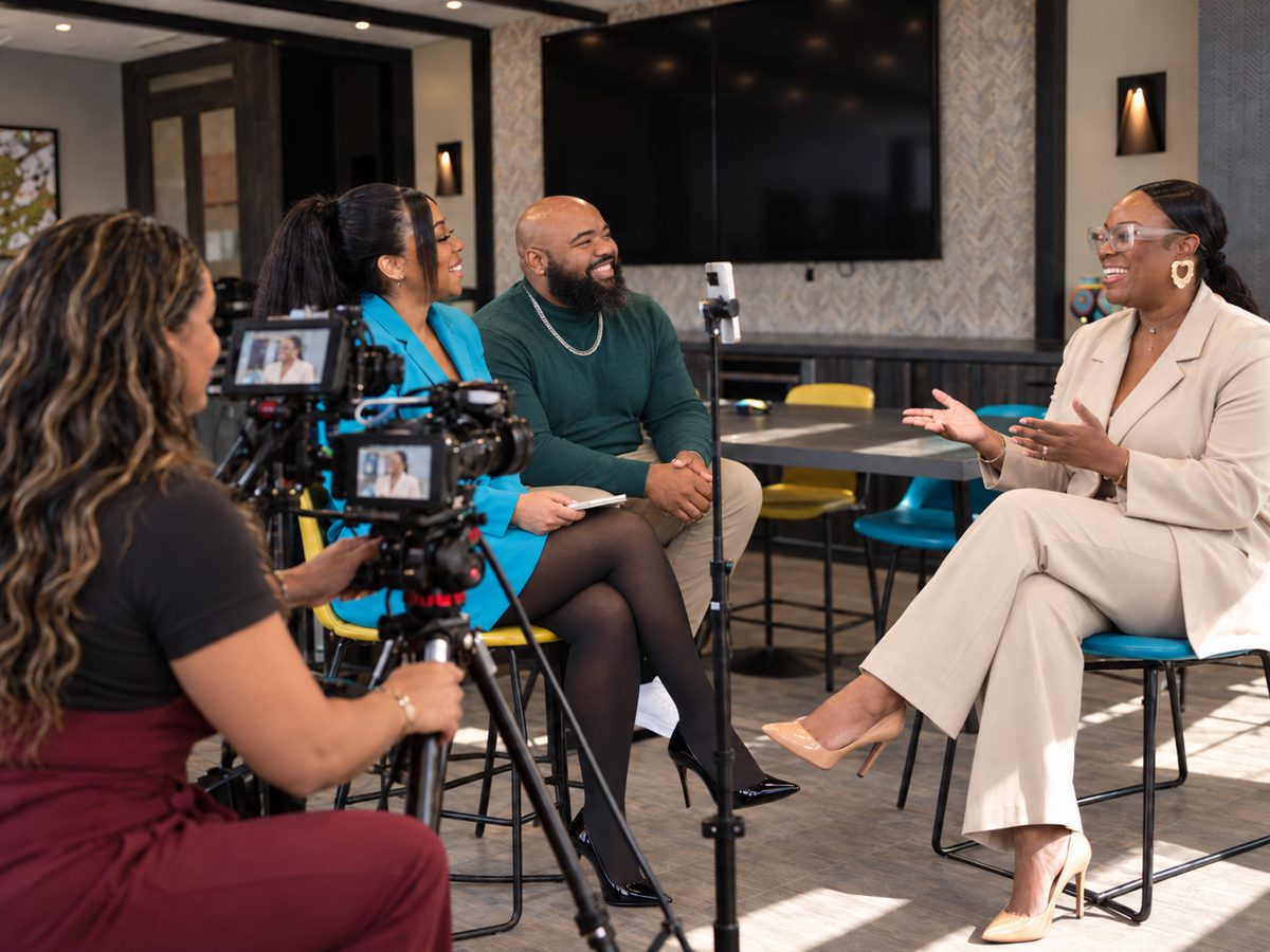 A client being interviewed on camera at a Venture to Bloom content session